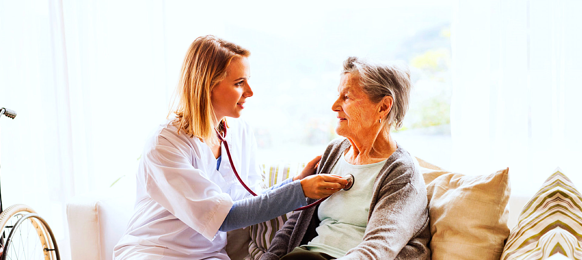 pharmacist checking senior woman's health